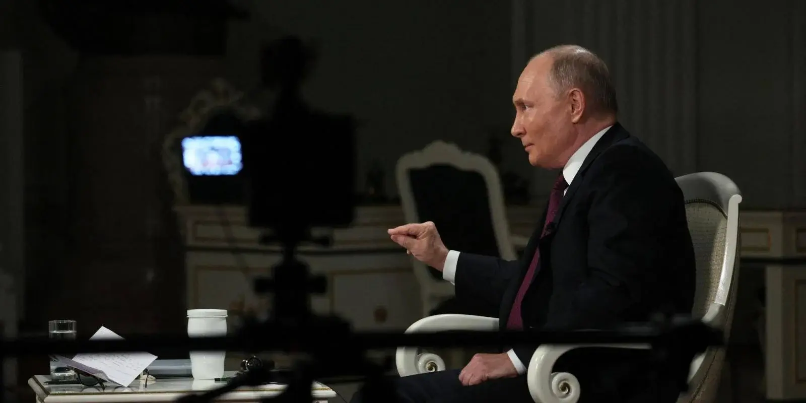 Tucker Carlson: Vladimir Putin's Recent Interview: Vladimir Putin engaging in a dynamic exchange of ideas in his recent interview.
