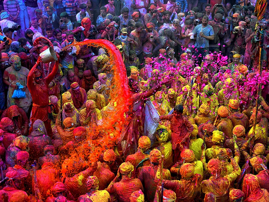A captivating bonfire of Holika Dahan, marking the beginning of Holi 2024 celebrations, with people gathered in reverence and anticipation.