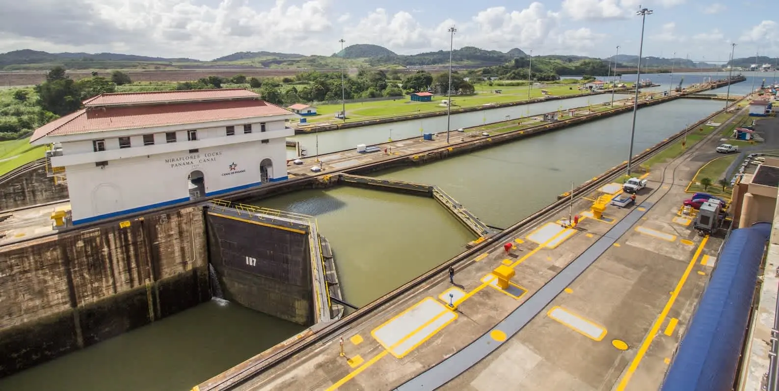 Panamax cargo ship traversing the Panama Canal, highlighting the canal's capacity to accommodate large vessels.
